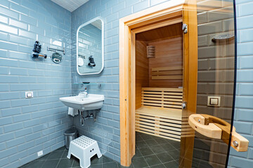 Bathroom and sauna. SPA treatments. Water treatments. Interior view of the sauna. Interior of classic wooden sauna. Modern bathroom. Relax concept.