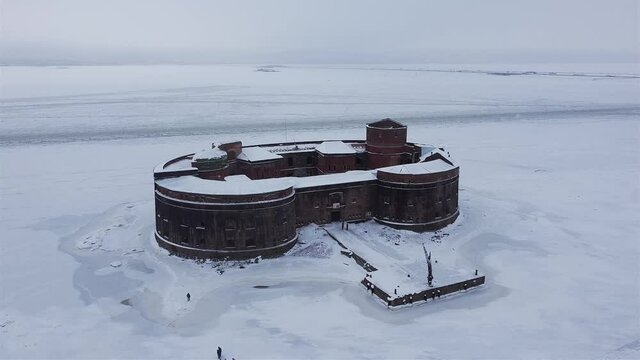 Defensive installations of the Fortress of Kronstadt. Forts of the Island Kotlin. Fort Alexander I in winter time aerial video.