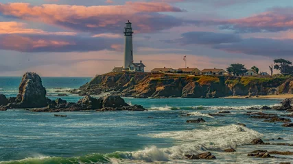 Tuinposter Clouds move out on the coastline shining the sunlight on the lighthouse and cliffs and the rocks on the northern coast in Pescadero , Ca.  © Larry D Crain