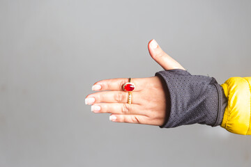 close up of a girl wearing a red ring