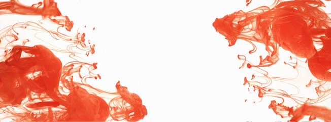 Orange ink dissolves in water, white isolated background. Abstraction in motion, colorful ink...