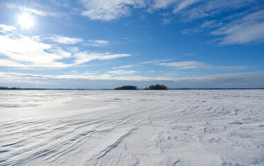 Fototapeta na wymiar Snowy plain on a clear winter day
