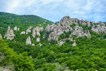 Mountains in the Valley of Ghosts. Some stand alone rocks are erosion columns. Folk name of them is Devil fingers. They formed during long ages of weathering. Shot near Alushta, Crimea