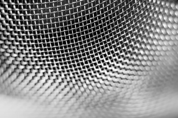 Metal mesh texture on a black background