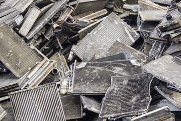 scrap pile of old used car aluminum cooling radiators