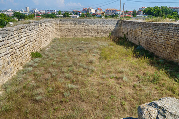 Fototapeta na wymiar Remains of urban water reservoir in Chersonesus Tauric, ancient city founded by Greeks. Modern city Sevastopol (Crimea) is on background