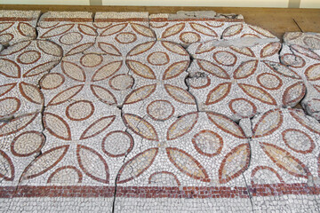 Floor mosaics of Byzantine era (VI AD). There are repeating pattern of circles and leaf-like ornaments. Authors are unknown