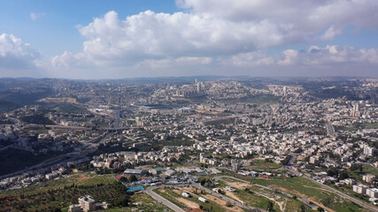 Fototapeta na wymiar Jerusalem City wide aerial Flight view Drone high altitude view of Jerusalem,clouds and Blue skies March 2021 Israel 