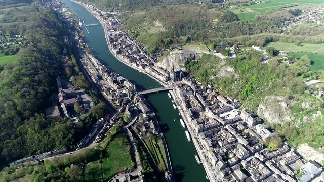 High altitude aerial view of Dinant is a Walloon city and municipality located in Namur Province in Belgium on the Meuse in the Ardennes also showing the cathedral and citadel 4k resolution quality