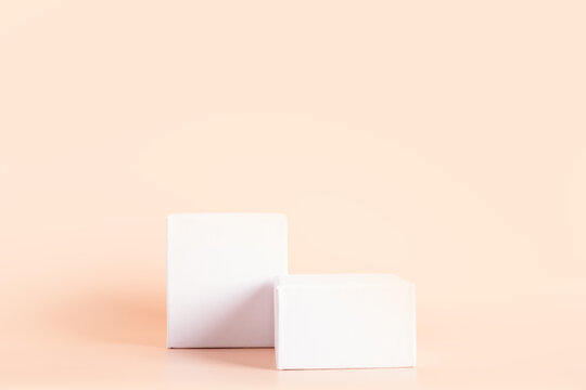 White empty podium stands on light color background.