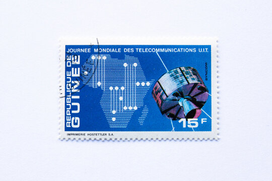  A stamp printed in Republic of Guinea shows a series of images of "Journee mondiale des telecommunications u.i.t", circa 1972. Syncom