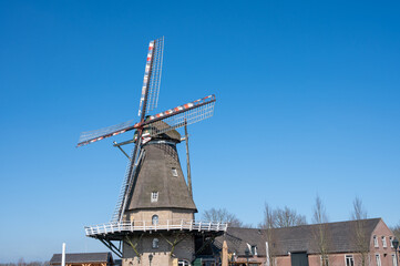 Fototapeta na wymiar Old Dutch grain wind mill in Veldhoven, North Brabant, Netherlands