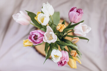 bouquet of pink tulips on wooden table