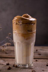 Dalgona Coffee. Whipped icing drink with instant coffee popular in Korea Creamy cocktail in tall Glasses.