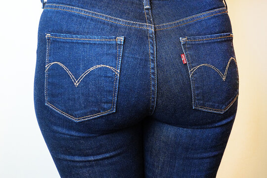 Woman In Jeans Levi's, Close Up Of Buttocks And Hips From Behind