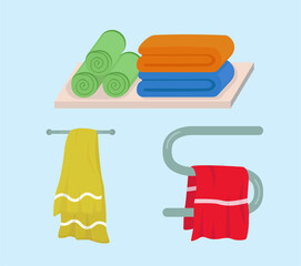 Bath towels. Towels folded and wrapped. Towel hanging on the dryer
