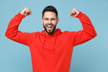 Young caucasian bearded strong sporty fitness attractive man 20s in casual red orange hoodie...
