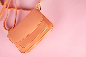 orange bag on pink background