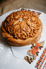 wedding bread loaf with voluminous twisted pigtails and decorations