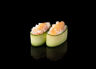 Gunkan maki sushi with shrimps, black background