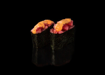 Spicy Gunkan maki sushi with tuna, black background