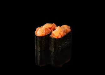 Spicy Gunkan maki sushi with salmon, black background