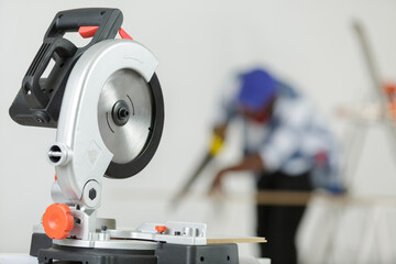 man cutting wood in the background