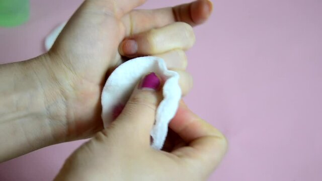 Close up of woman using nail buffer when doing manicure, polishing nails at home. Smiling lady testing new beauty products and modern cosmetics, doing morning makeup or daily nail care routine