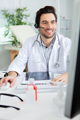 Fototapeta premium doctor having video conference on laptop