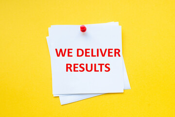 Text we deliver results on white sticker with yellow background