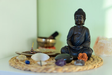 Meditation corner with Buddha statue in the bedroom.