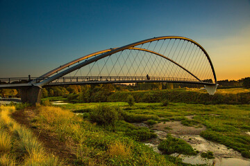 Double arch footbridge at sunset  from Salem Riverfront park to Minto Island, Oregon.