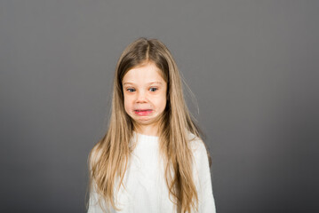 Fototapeta premium Happy surprised beautiful little child girl looking to camera. Human emotions and facial expression