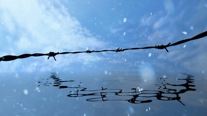 Snowing on farbwire reflected in water