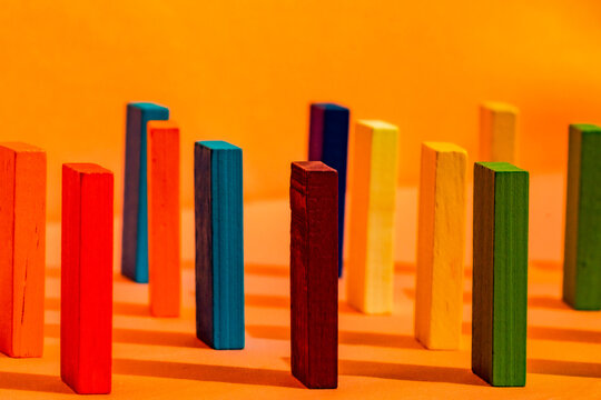 Colorful construction blocks on orange background