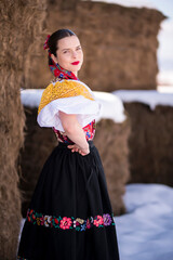 Young beautiful slovak woman in traditional dress. Slovak folklore