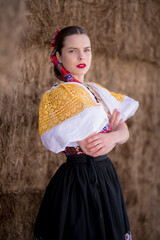 Young beautiful slovak woman in traditional dress. Slovak folklore