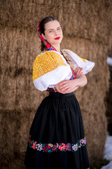 Young beautiful slovak woman in traditional dress. Slovak folklore