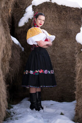 Young beautiful slovak woman in traditional dress. Slovak folklore