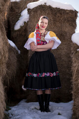 Young beautiful slovak woman in traditional dress. Slovak folklore