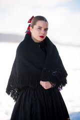 Young beautiful slovak woman in traditional dress. Slovak folklore
