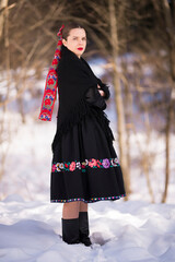 Young beautiful slovak woman in traditional dress. Slovak folklore
