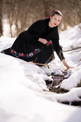 Young beautiful slovak woman in traditional dress. Slovak folklore
