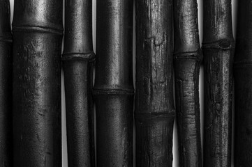 Bamboo activated charcoal sticks isolated on white background.