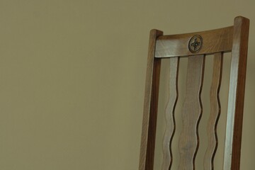 zoom in Backrest of a  antique oak chair. 

This expensive furniture is made in England. 
dim...