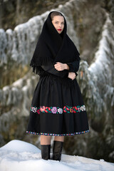 Young beautiful slovak woman in traditional dress. Slovak folklore