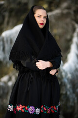 Young beautiful slovak woman in traditional dress. Slovak folklore