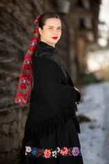 Young beautiful slovak woman in traditional dress. Slovak folklore