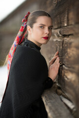 Young beautiful slovak woman in traditional dress. Slovak folklore