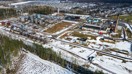Aerial drone image of street asphalt factory company. Industry bitumen storage from above. Production of bitumen. Petrochemical industry concept.